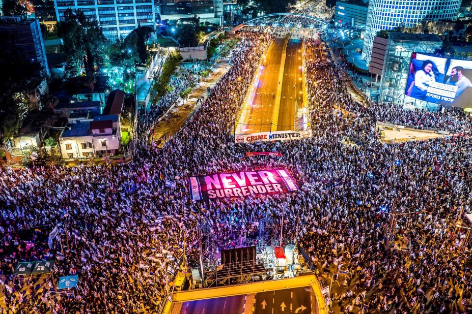People in Tel Aviv, Israel, protest against their government, and <a href="https://www.cnn.com/2023/02/20/middleeast/israel-protests-knesset-judicial-reforms-bill-intl/index.html" target="_blank">its plans to overhaul the nation's judicial system</a>, on Saturday, March 18.