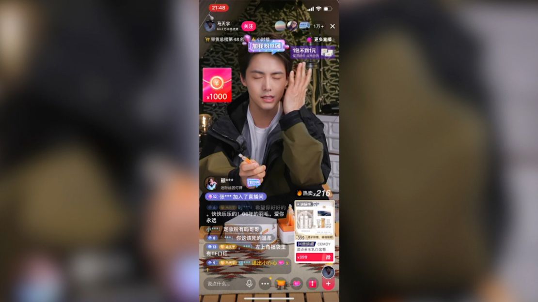 A Douyin livestreamer with product details displayed on screen.