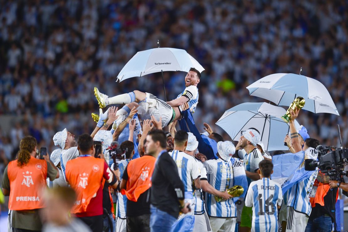 Lionel Messi is hoisted aloft by his Argentina teammates as they celebrate the World Cup win.