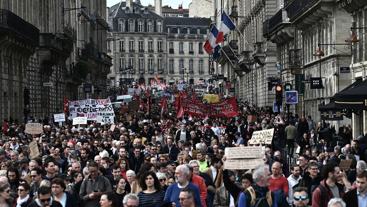 Protesters walk as they take part in a demonstration on a national action day, a week after the government pushed a pensions reform through parliament without a vote, using the article 49.3 of the constitution, in Bordeaux, western France, on March 23, 2023. French President defiantly vowed to push through a controversial pensions reform on March 22, 2023, saying he was prepared to accept unpopularity in the face of sometimes violent protests.
