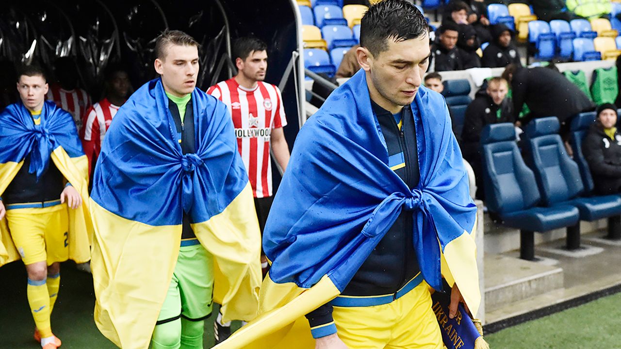 Midfielder Taras Stepanenko leads Ukraine out against Brentford B on March 23, 2023.