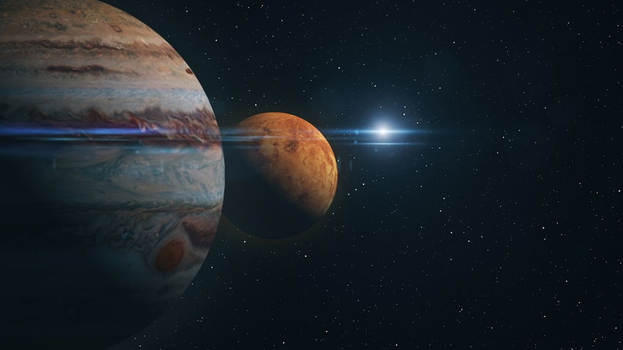 Venus and Jupiter appear exceptionally close to one another in an artist's rendering.