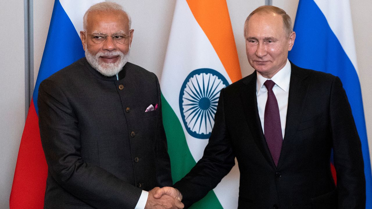 Russian President Vladimir Putin, right, shakes hands with Indian Prime Minister Narendra Modi during their meeting on the sideline of the 11th edition of the BRICS Summit, in Brasilia, Brazil November 13, 2019. 