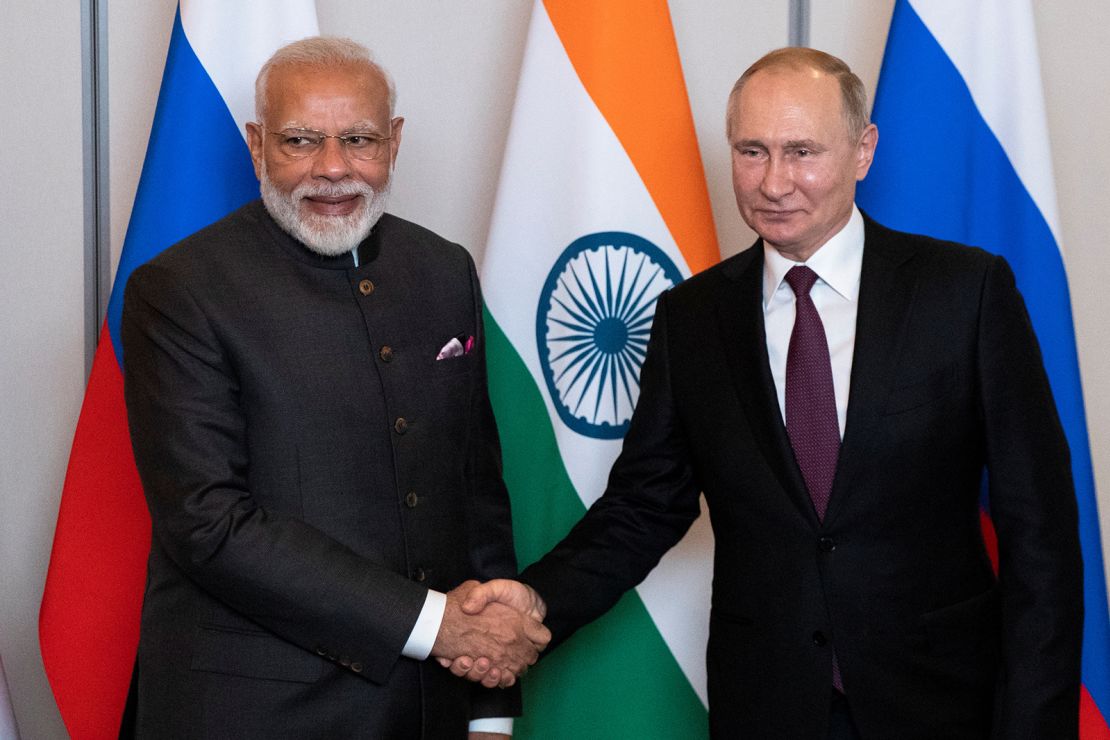 Russian President Vladimir Putin, right, shakes hands with Indian Prime Minister Narendra Modi during their meeting on the sideline of the 11th edition of the BRICS Summit, in Brasilia, Brazil November 13, 2019. 