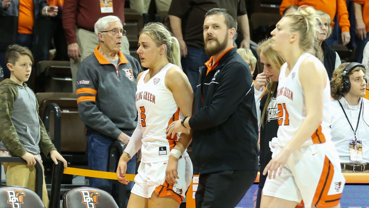 Bowling Green Falcons guard Elissa Brett (left) is assisted off of the court after an altercation with Memphis Tigers guard Jamirah Shutes (not pictured) during the postgame handshake.
