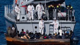 LAMPEDUSA, ITALY - 2023/02/21: The crew of a Guardia di Finanza boat rescuing 40 to 50 migrants. At around 7:30 a.m. on Tuesday, 21 February, 40 sub-Saharan migrants were rescued from a precarious metal boat. There were 20 minors onboard, 18 of whom were unaccompanied by adults.