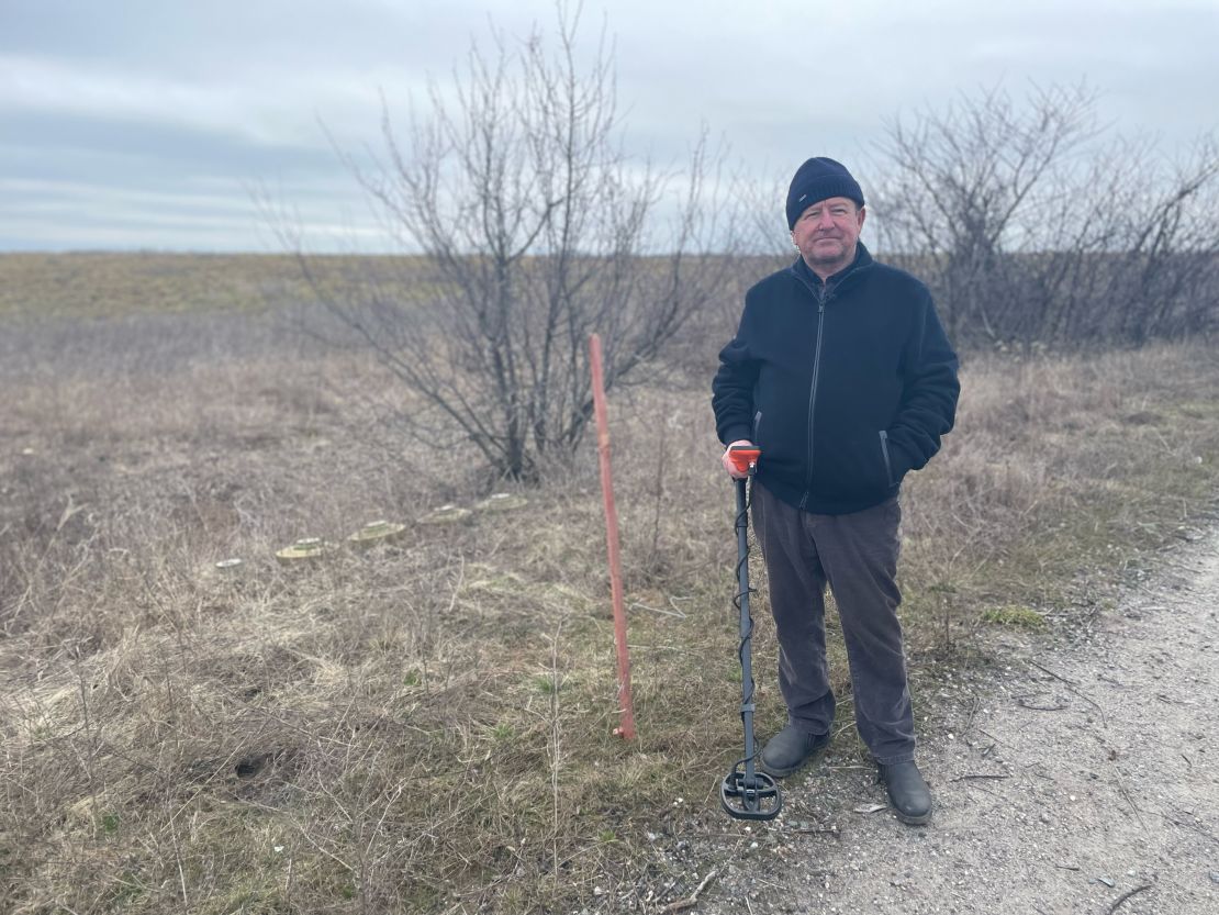Oleksandr Havriluk with some of the Russian anti-tank mines he dug up in his fields using a metal detector.