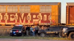 Two migrants died and over a dozen more needed urgent medical attention after being found in train cars in Uvalde, Texas, on March 24, 2023.