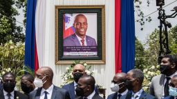 Officials attend a ceremony in honor of late Haitian President Jovenel Moise at the National Pantheon Museum in Port-au-Prince, Haiti, on July 20, 2021. - The ceremony comes as designated Prime Minister Ariel Henry prepared to replace interim Prime Minister Claude Joseph,  after the July 7 attack at Moïse's private home.