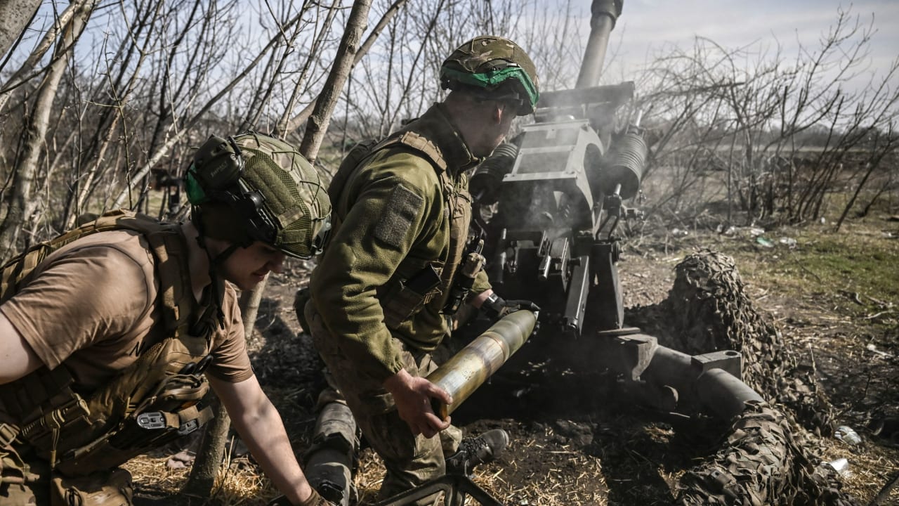 Ukrainian servicemen fire with an M119 105mm howtitzer at Russian positions near Bakhmut, on March 23, 2023, amid the Russian invasion of Ukraine. (Photo by Aris Messinis / AFP) (Photo by ARIS MESSINIS/AFP via Getty Images)