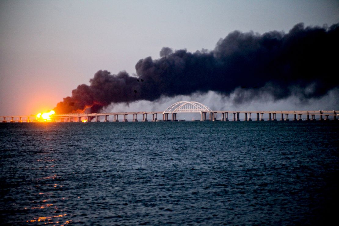 An explosion causes a fire on the bridge across the Kerch Strait linking Russia to occupied Crimea, on October 08, 2022.