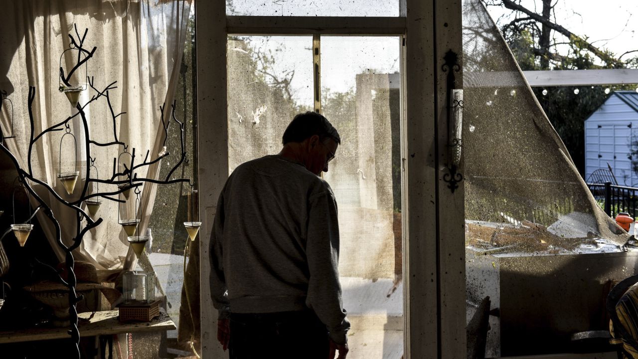 Resident Noel Crook walks through his home Saturday, March 25, 2023, while surveying damage in Silver City, Miss., following Friday's deadly tornado. 