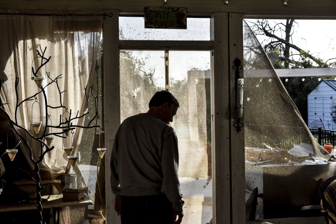 Resident Noel Crook surveys the damage Saturday in Silver City, Mississippi.