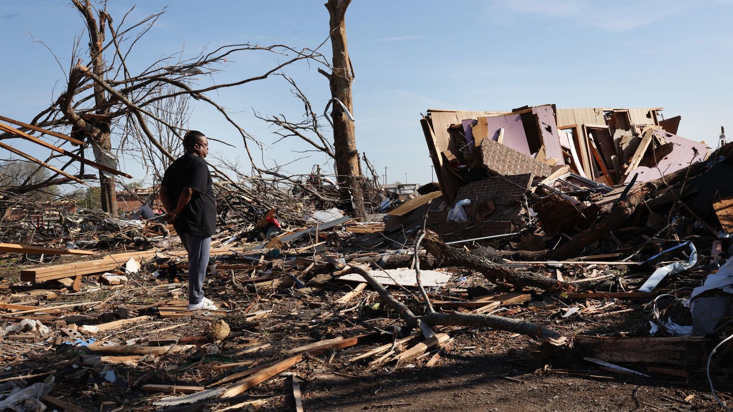 Cornelius Williams looks at what remains of the home in which he grew up after it was hit on Friday evening by an EF-4 tornado on March 26, 2023 in Rolling Fork, Mississippi.