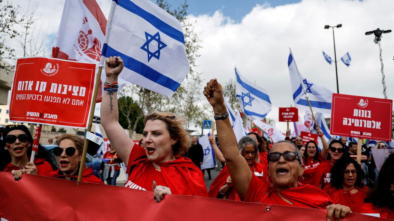 Women dressed as handmaidens from "The Handmaid's Tale" attend a demonstration in Jerusalem on Monday.