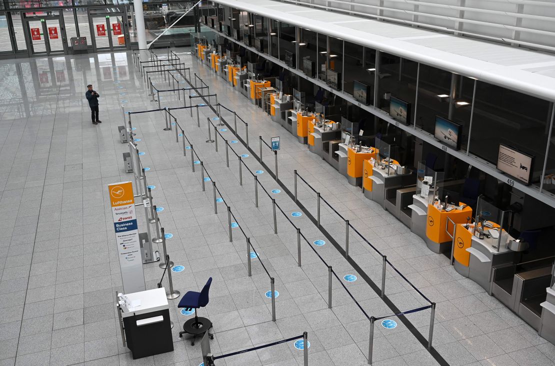 A man stands in a empty terminal of the Franz Josef-Strauss airport in Munich, southern Germany, during an early strike on March 26, 2023.