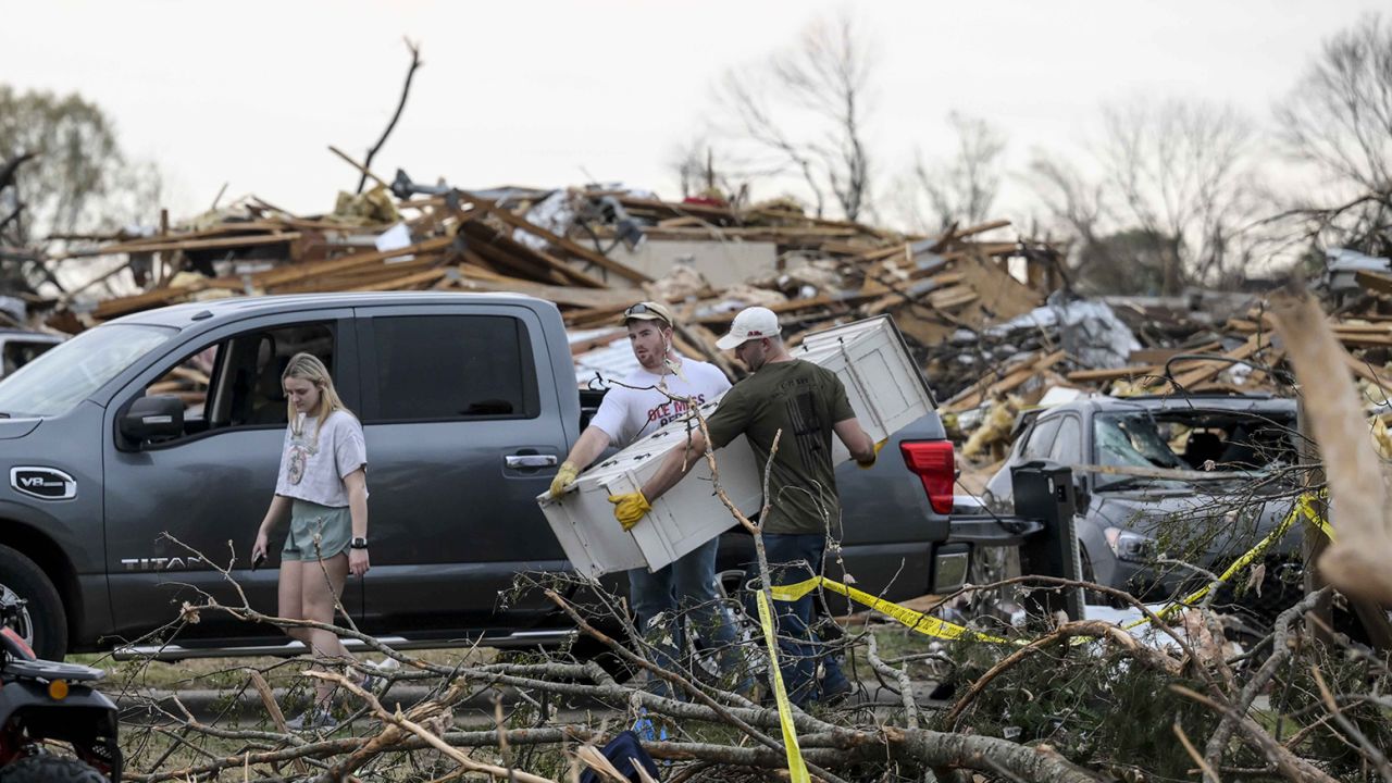 Residents of Rolling Fork, Mississippi, working to recover after a tornado ripped through the city on March 26, 2023.