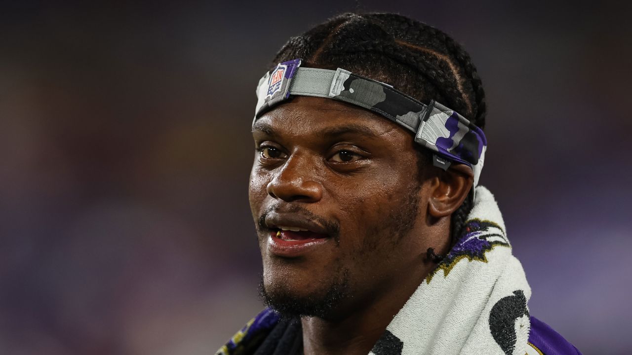 BALTIMORE, MD - AUGUST 11: Lamar Jackson #8 of the Baltimore Ravens looks on from the sidelines during the second half against the Tennessee Titans at M&T Bank Stadium on August 11, 2022 in Baltimore, Maryland. (Photo by Scott Taetsch/Getty Images)