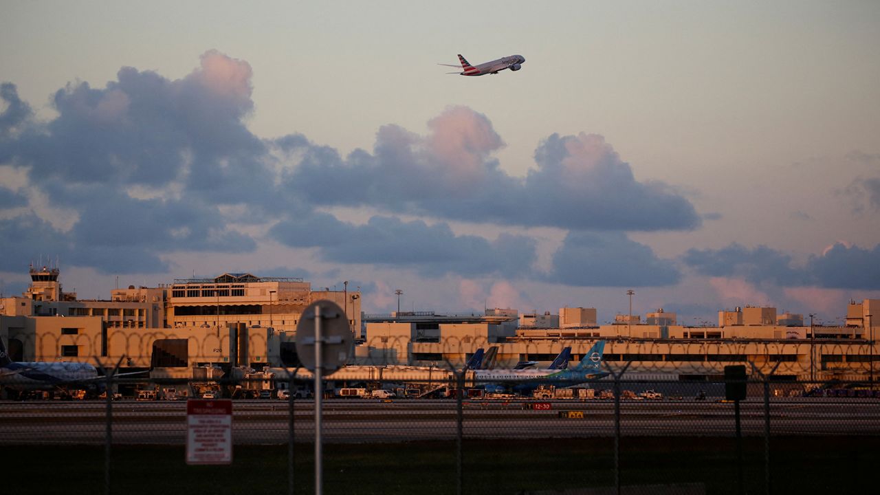 An American Airlines plane takes off from Miami International Airport on January 2, 2023. The airport is advising people to show up three hours early for a domestic flight for spring travel.