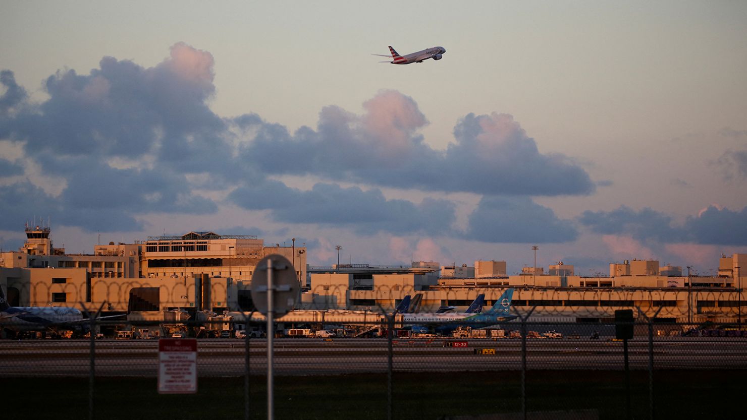 An American Airlines plane takes off from Miami International Airport on January 2, 2023. The airport is advising people to show up three hours early for a domestic flight for spring travel.