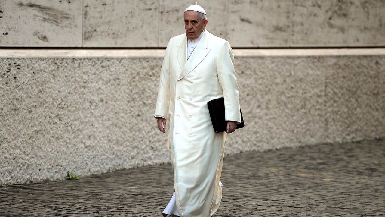 Pope Francis arrives for the Papal consistory before the nominations of new cardinals at the Vatican on February 13, 2015. Pope Francis on February 12 urged Catholic cardinals to back his plans to reform the scandal-hit Vatican bureaucracy in order to help the Church reach out to believers more effectively, including on issues such as the environment. 