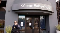 A security guard stands outside of the entrance of the Silicon Valley Bank headquarters in Santa Clara, California, U.S., March 13, 2023.