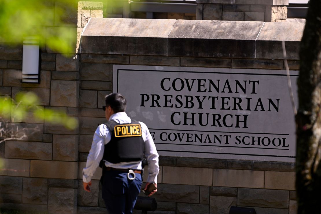A police officer walks by an entrance to The Covenant School after a shooting on Monday.