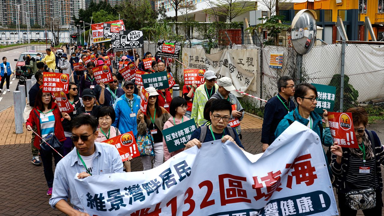 Protesters were required to wear numbered lanyards during a protest in Hong Kong on March 26, 2023. 
