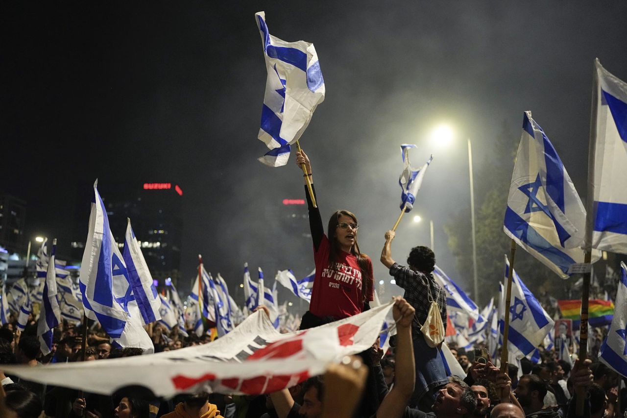 People protest in Tel Aviv on March 26.
