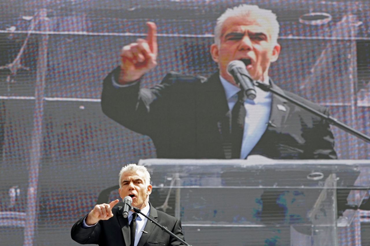 Yair Lapid, Israel's opposition leader and former premier, speaks outside the Knesset on March 27. Lapid urged Netanyahu to reverse his decision to fire Gallant and told the Knesset that the country had been "taken hostage by a bunch of extremists with no brakes and no boundaries."