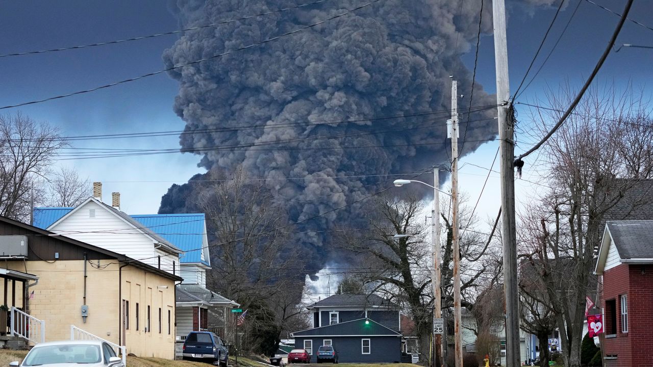 A large plume of smoke is seen rising over East Palestine, Ohio, where about 50 Norfolk Southern train cars, including 10 carrying hazardous materials, derailed in a fiery crash in early February. 