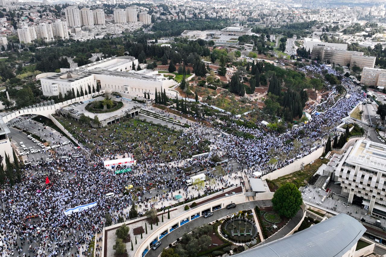 People protest outside the Knesset on March 27.