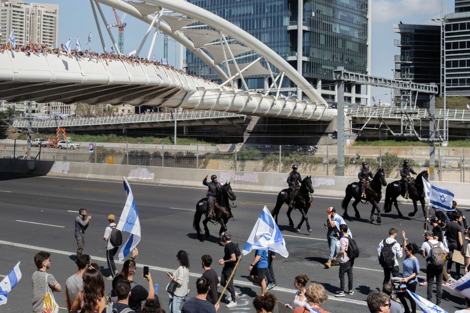 Mounted police move in on protesters blocking a highway in Tel Aviv on March 27.