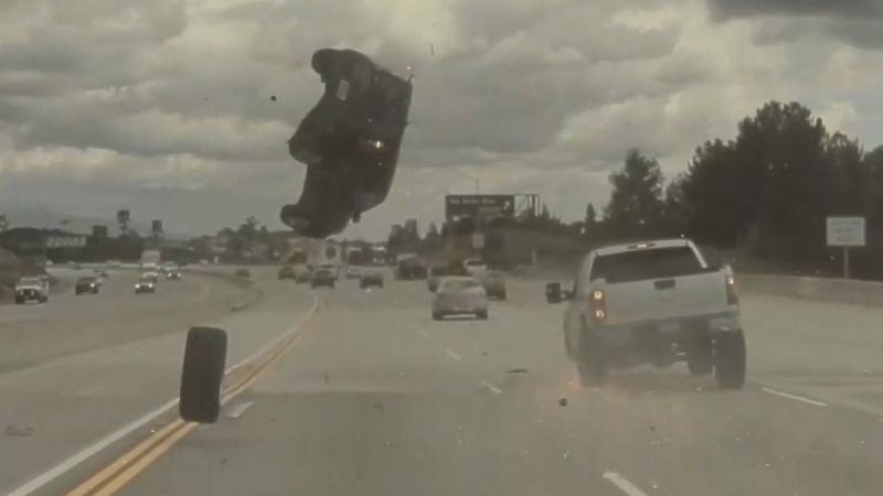 Dashcam video shows car flip mid-air on freeway after hitting a loose tire | CNN