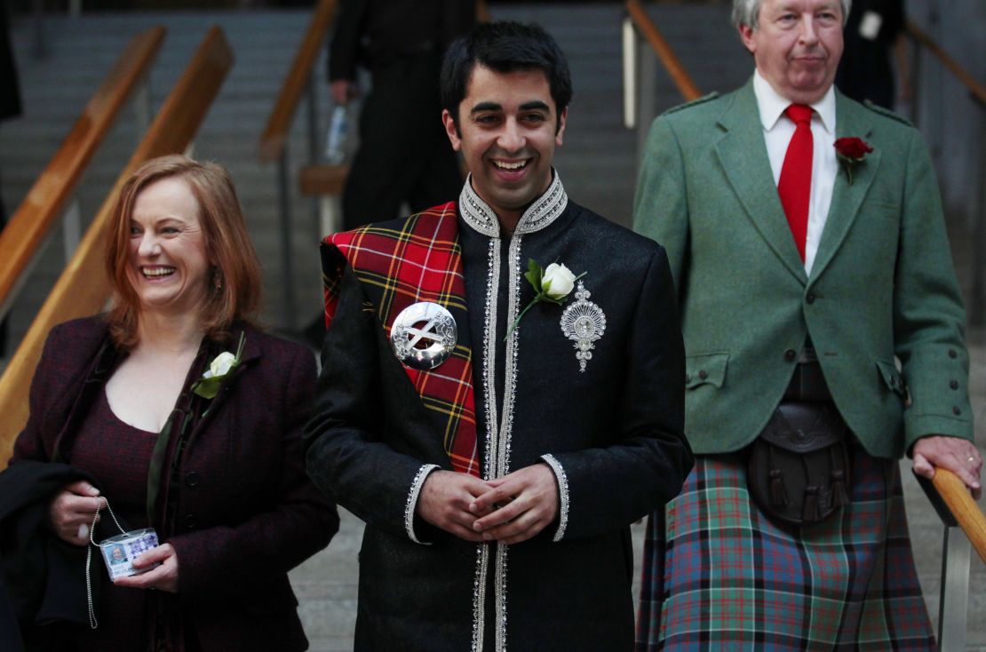 Humza Yousaf smiles as he walks down stairs after the Oath and Affirmation ceremony the Scottish Parliament in Edinburgh, Scotland May 11, 2011. 