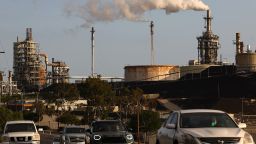 Vehicles pass the Phillips 66 Los Angeles Refinery Wilmington Plant on November 28, 2022 in Wilmington, California. 