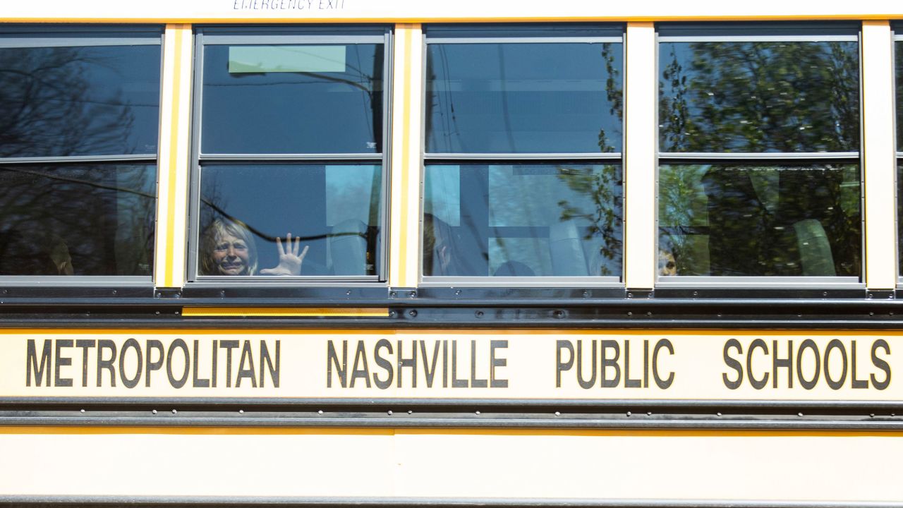 A child weeps while on the bus leaving the Covenant School following Monday's mass shooting.