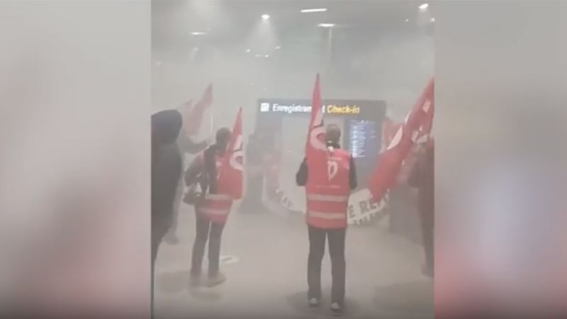 Protesters enter French airport amid demonstrations over pension reforms | CNN