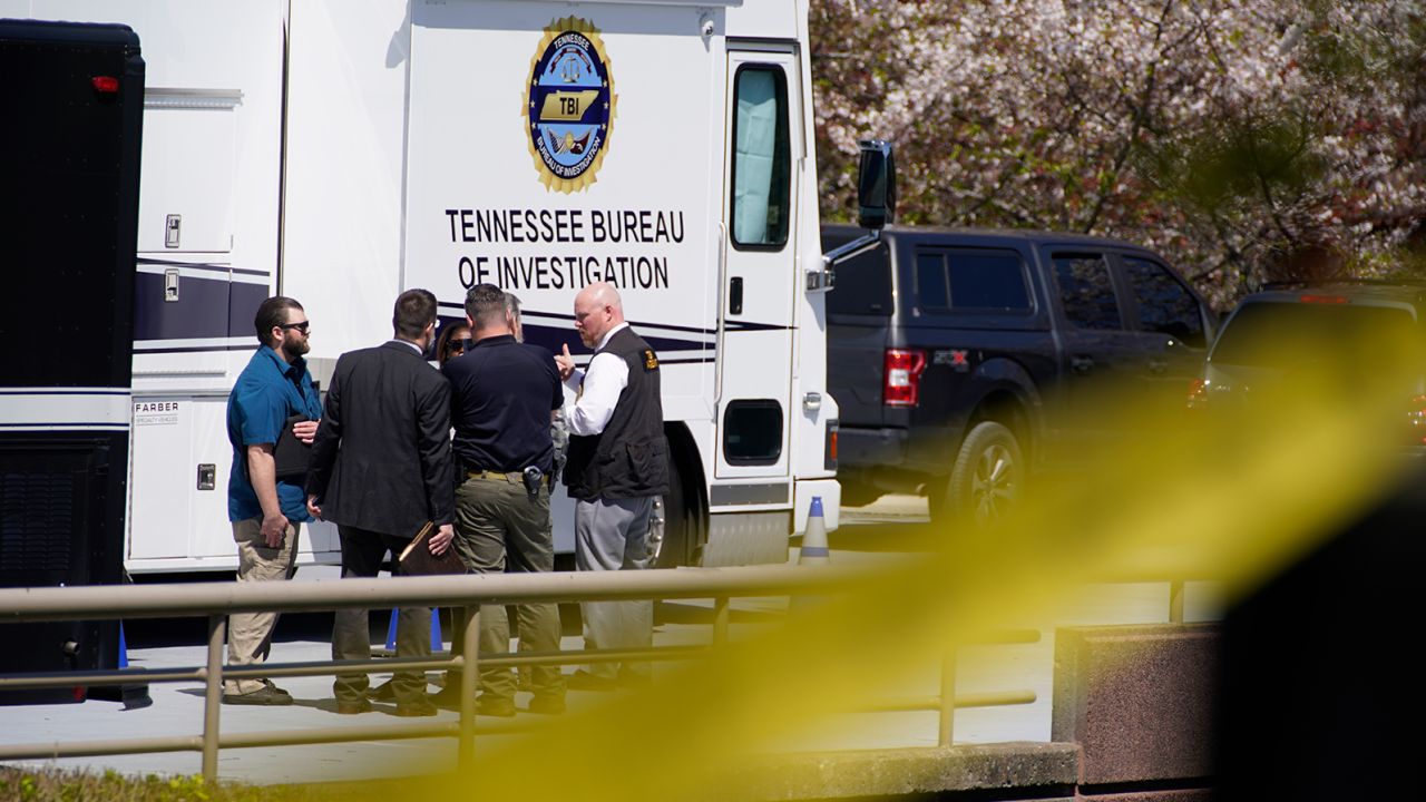 Metro Nashville Police officers gather near The Covenant School, a private Christian school in Nashville, Tenn., following a deadly shooting Monday, March 27, 2023. A shooter wielding two "assault-style" rifles and a pistol also died after being shot by police. 