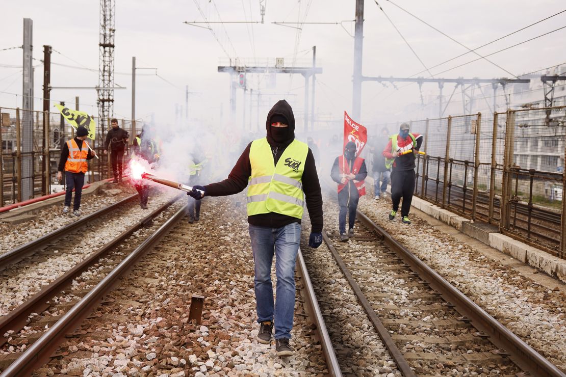 Railway workers demonstrate on the tracks at Gare de Lyon train station in Paris, France on Tuesday, as a fresh round of demonstrations is planned against proposed pension reforms.