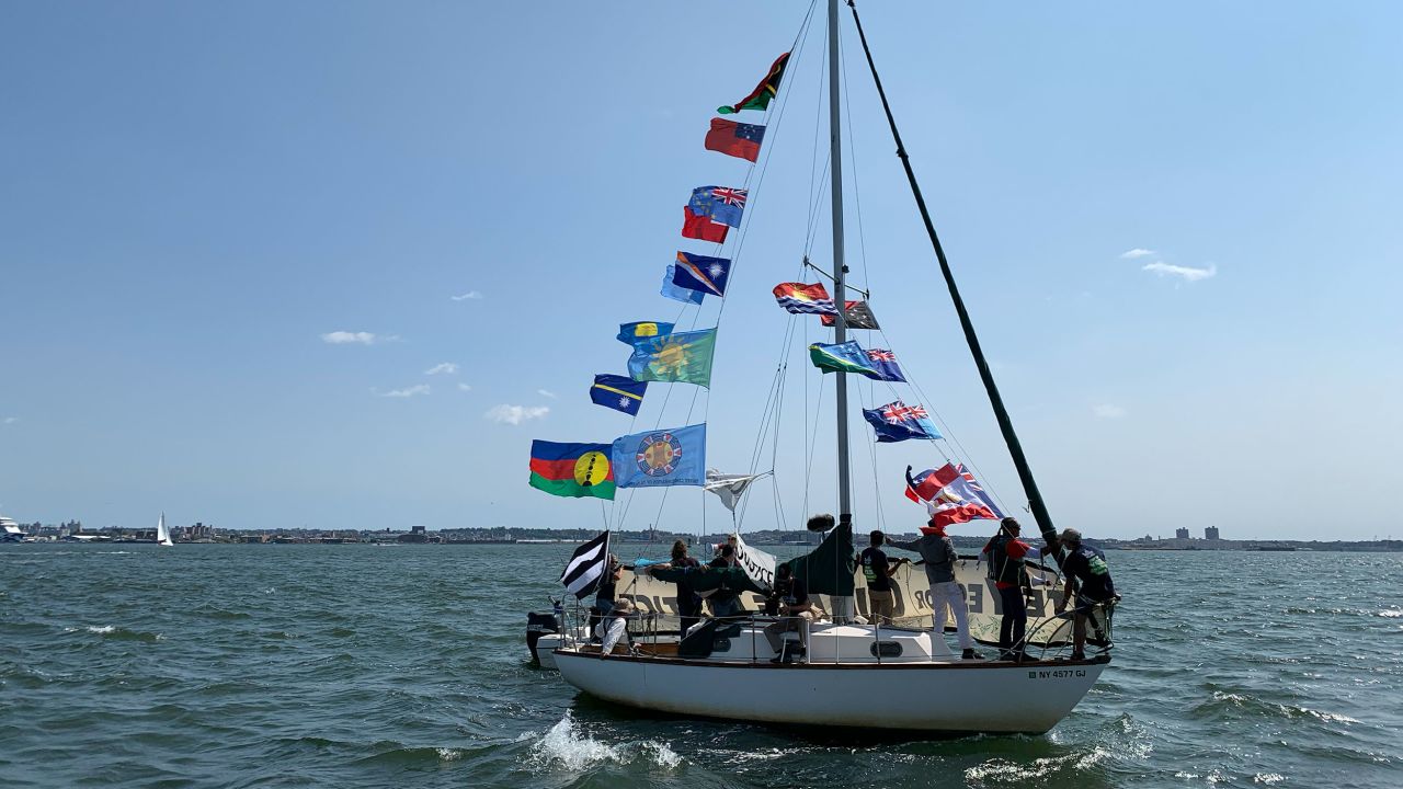 Pacific islander activists rallying in boats in front of the UN headquarters in New York during UN Climate Week in 2022.