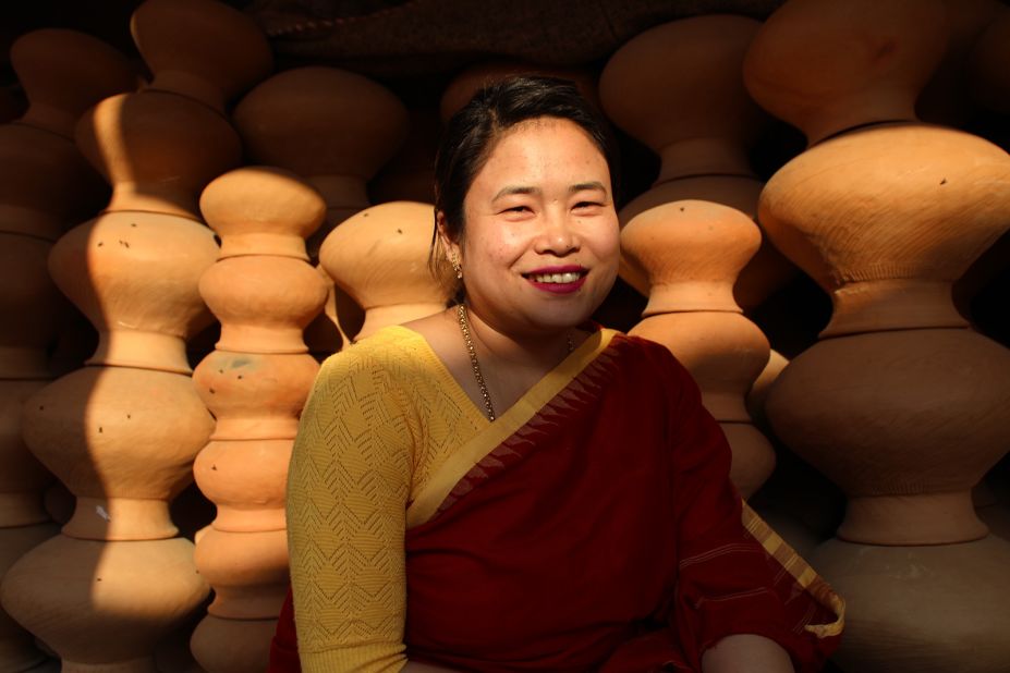 <strong>The heiress:</strong> Priya Kharaibam, 34, is the third-generation woman in her family to sell handmade pots at the market.