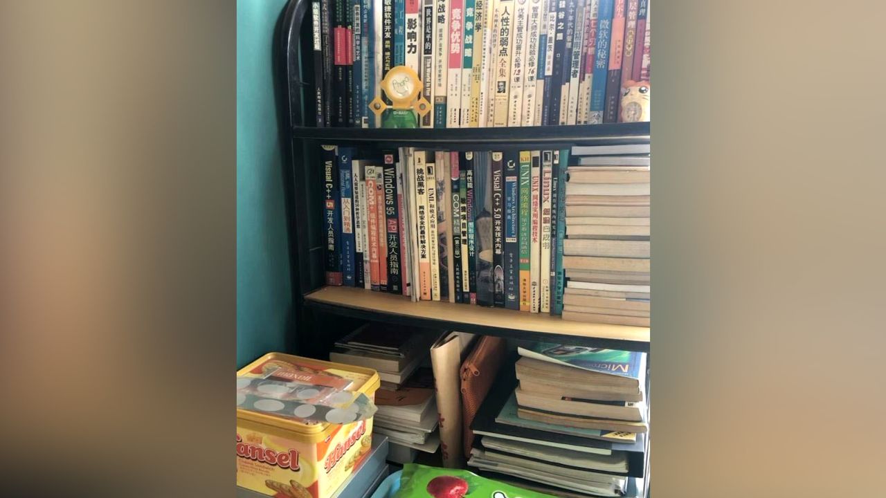 Books line the shelves of Ruan's study.