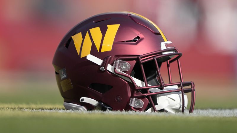 NextImg:Magic Johnson and Josh Harris group officially place bid on Washington Commanders | CNN Business