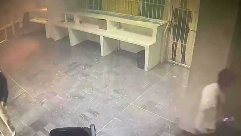 Video shows detainees locked behind gates as fire breaks out in detention center | CNN