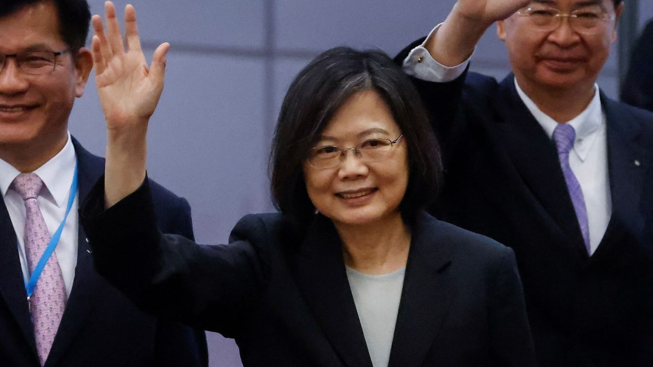 Taiwan's President Tsai Ing-wen waves near the boarding gate as she departs for a 10-day international trip on March 29, 2023. 