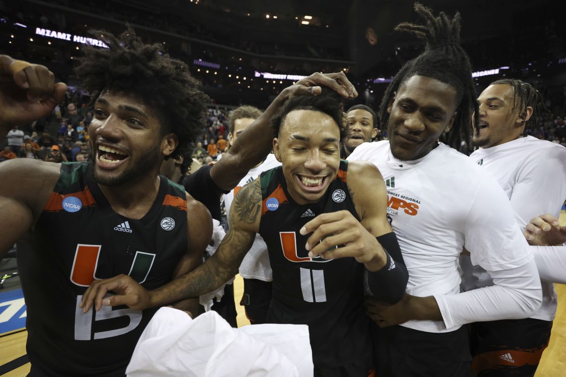 Norchad Omier and Jordan Miller celebrate with teammates after defeating the Texas Longhorns in the Elite Eight.