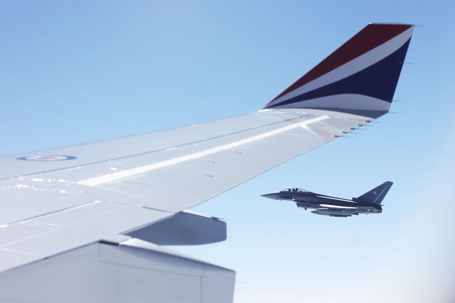 A German jet escorts the plane of Charles and Camilla on their way to Germany.