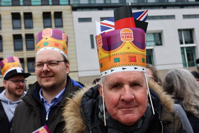 People in Berlin wait to greet the King and Queen Consort.