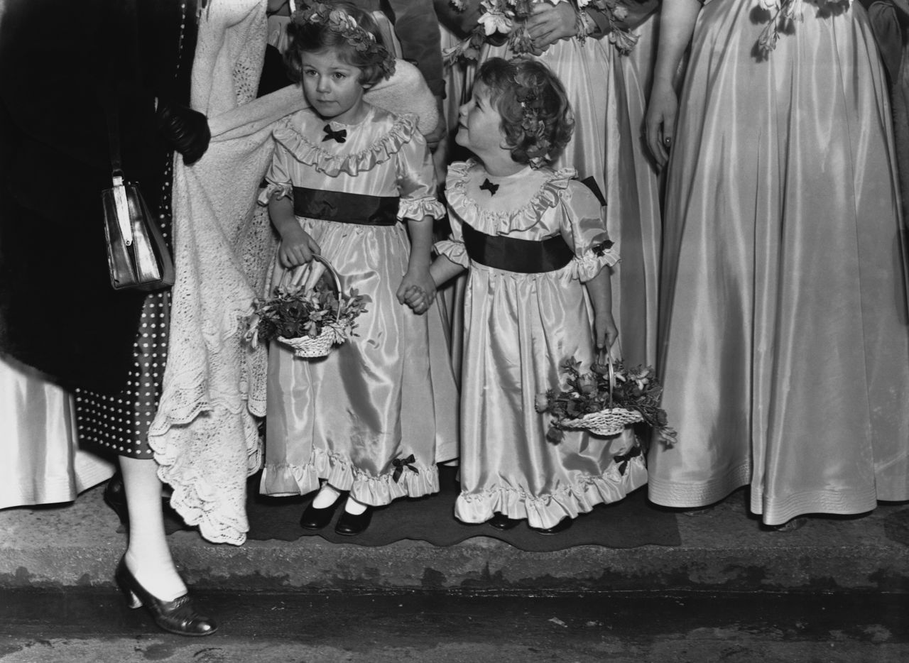 Camilla and her younger sister, Annabel, serve as bridesmaids at the wedding of their uncle Jeremy Cubitt and actress Diana Du Cane in 1952. Camilla was born on July 17, 1947. Her father, Bruce Shand, was a retired British Army officer who later became a wine merchant. Her mother, Rosalind Cubitt, was the daughter of the 3rd Baron of Ashcombe.